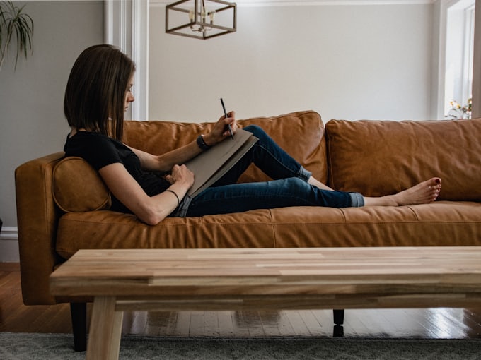 A woman journaling calmly at home